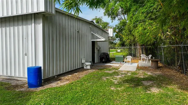 a view of a backyard with sitting area