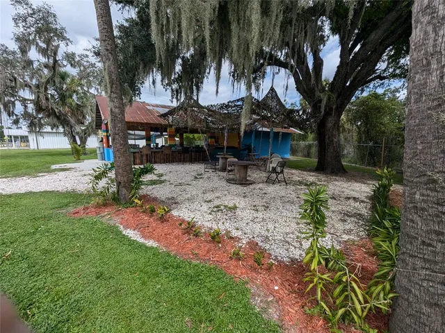 a dining room with furniture and a flat screen tv