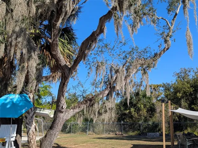 a kitchen with stainless steel appliances a stove and a microwave