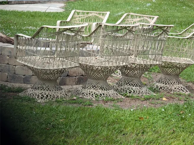 an aerial view of a house with a garden and lake view