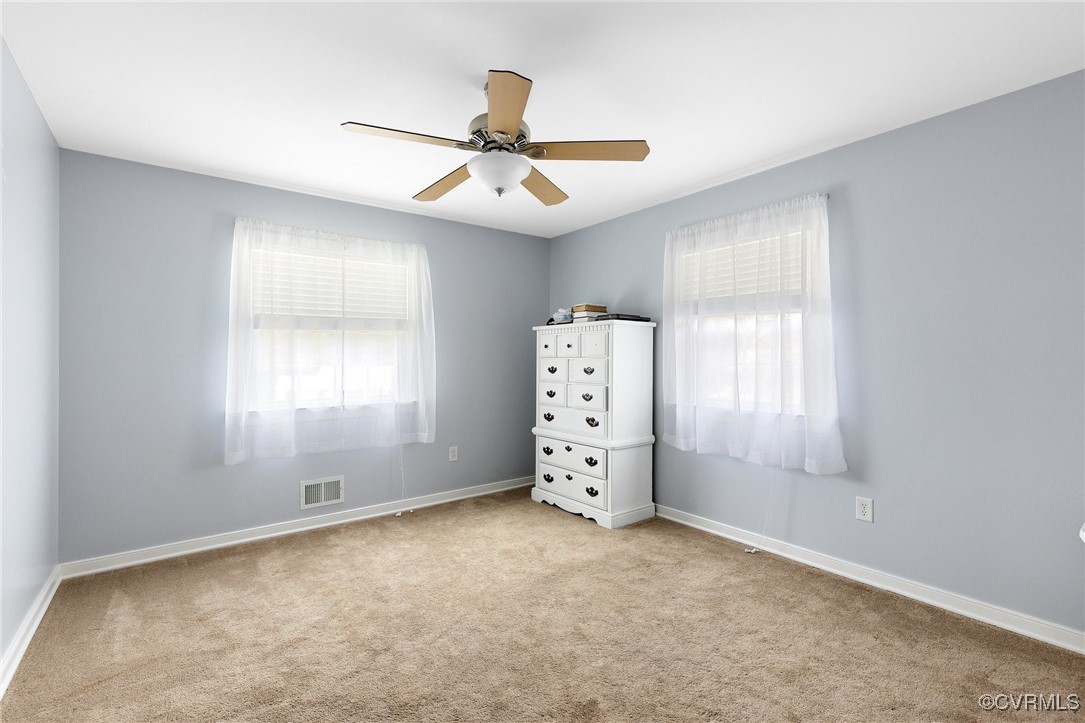 8119 Inca Court North Chesterfield, VA 23237 - Photo 13 of 36 an empty room with windows and fan