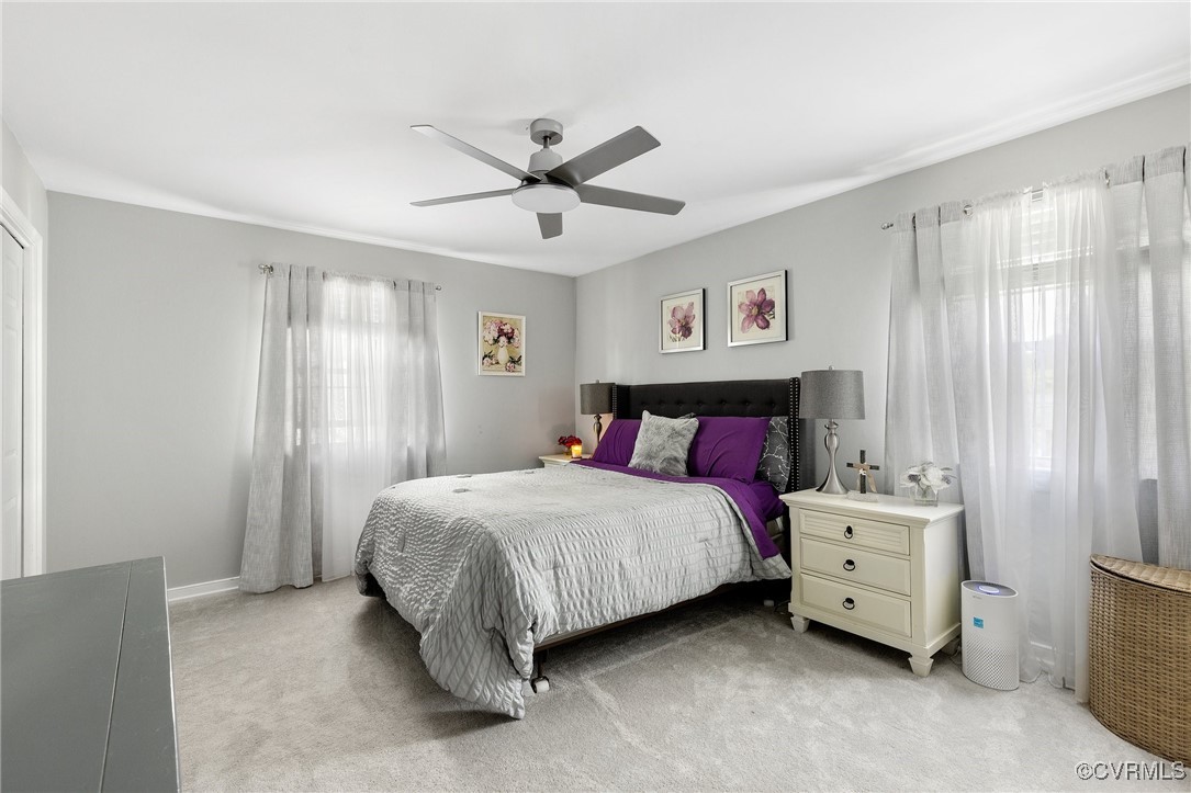 8119 Inca Court North Chesterfield, VA 23237 - Photo 14 of 36 a bedroom with a bed and a chandelier