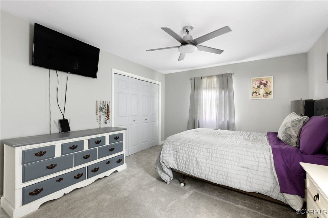 8119 Inca Court North Chesterfield, VA 23237 - Photo 16 of 36 a bedroom with a bed and a flat tv screen on the dresser