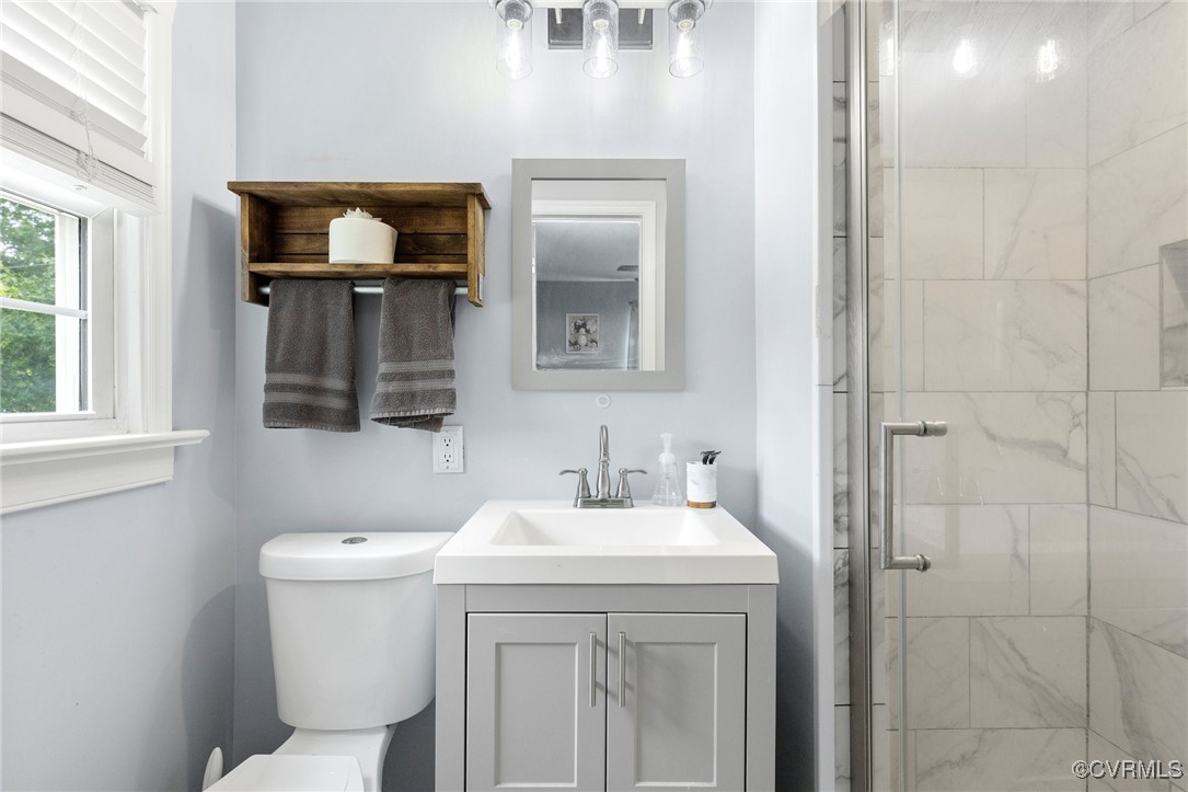 8119 Inca Court North Chesterfield, VA 23237 - Photo 17 of 36 a bathroom with a toilet sink and mirror