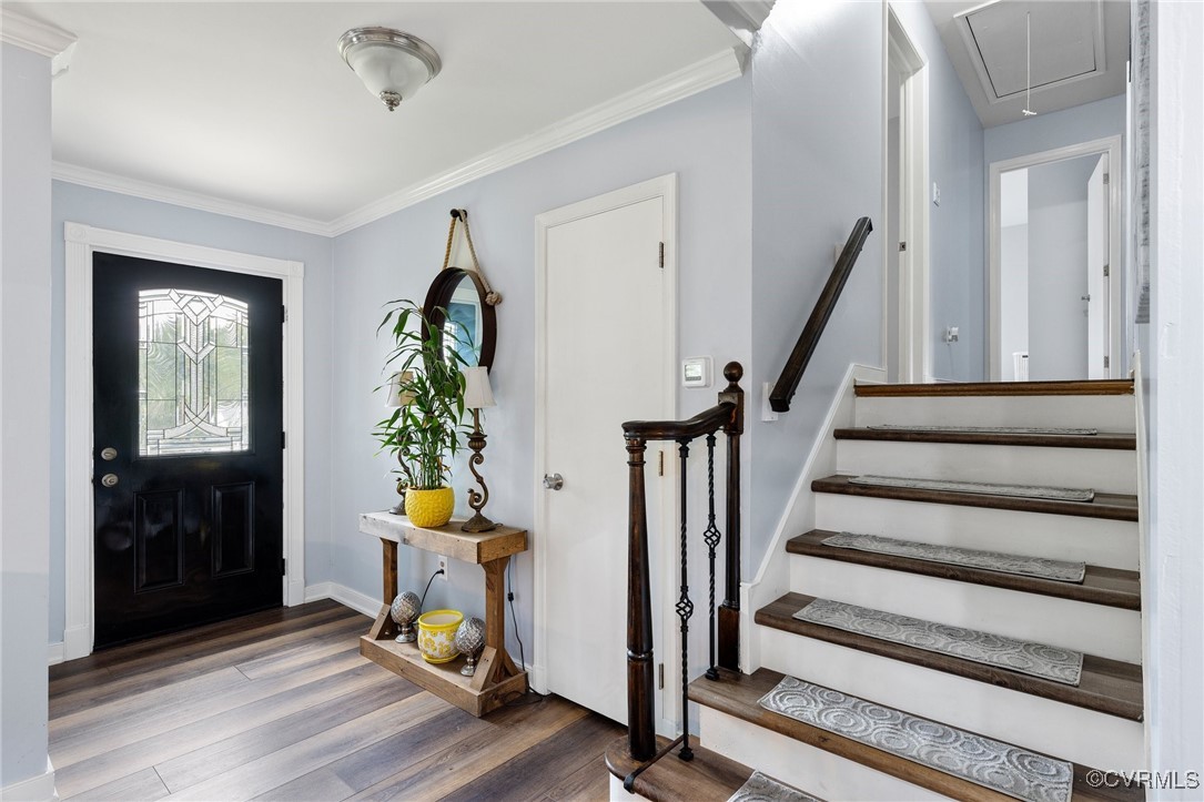 8119 Inca Court North Chesterfield, VA 23237 - Photo 2 of 36 a living room with wooden floor and a chandelier