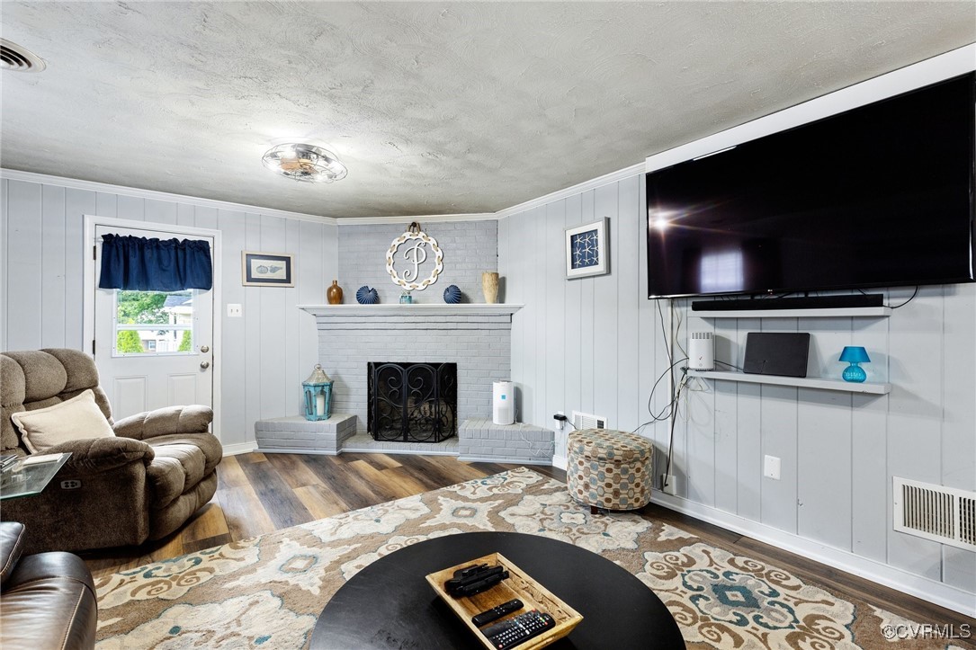 8119 Inca Court North Chesterfield, VA 23237 - Photo 24 of 36 a living room with furniture and a flat screen tv