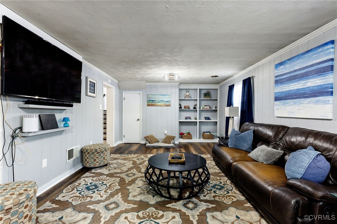 8119 Inca Court North Chesterfield, VA 23237 - Photo 26 of 36 a living room with furniture and a flat screen tv