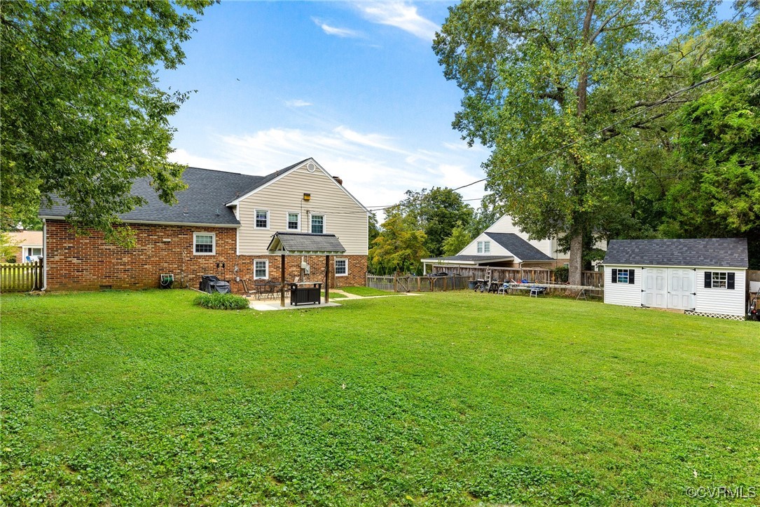 8119 Inca Court North Chesterfield, VA 23237 - Photo 31 of 36 a front view of a house with a garden and trees