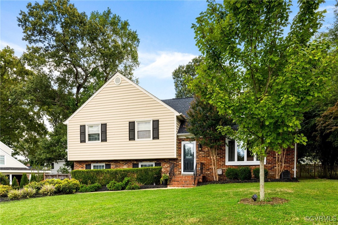 8119 Inca Court North Chesterfield, VA 23237 - Photo 36 of 36 a front view of a house with a yard and trees