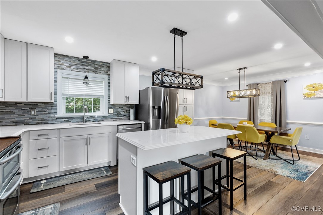 8119 Inca Court North Chesterfield, VA 23237 - Photo 6 of 36 a kitchen with a table chairs and microwave
