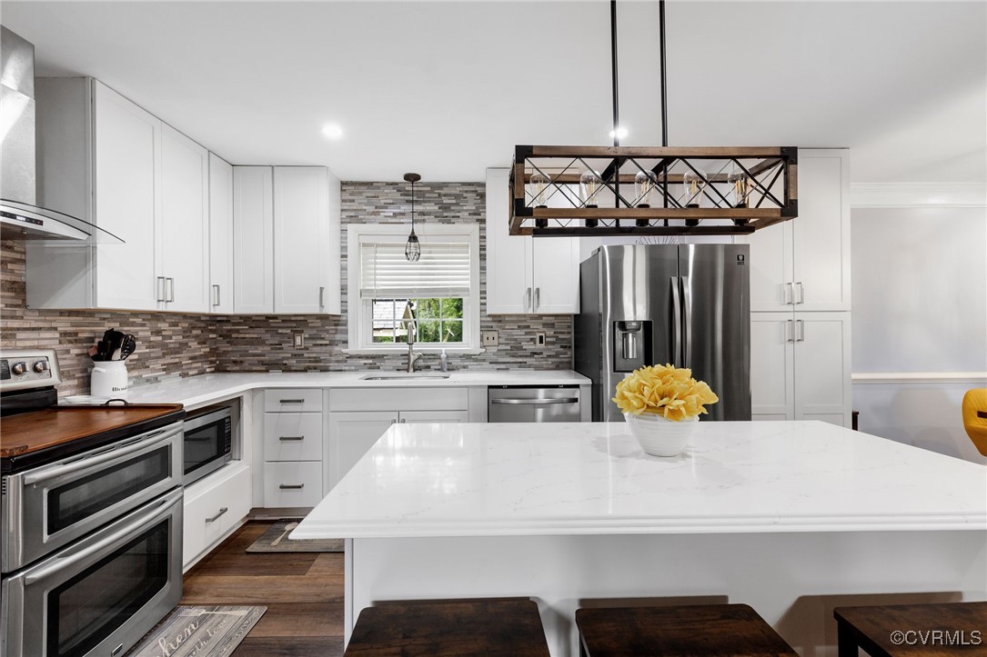 8119 Inca Court North Chesterfield, VA 23237 - Photo 7 of 36 a kitchen with a sink a stove and chairs