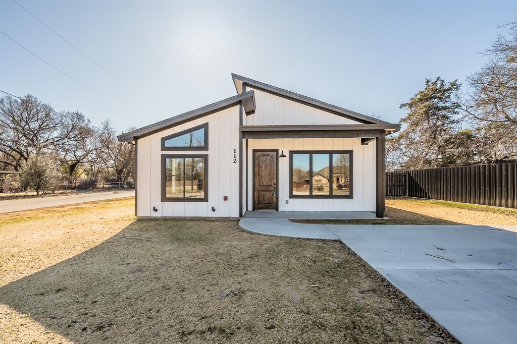 112 Stevens Street Bridgeport, TX 76426 - Photo 1 of 37 a view of an house with backyard and swimming pool