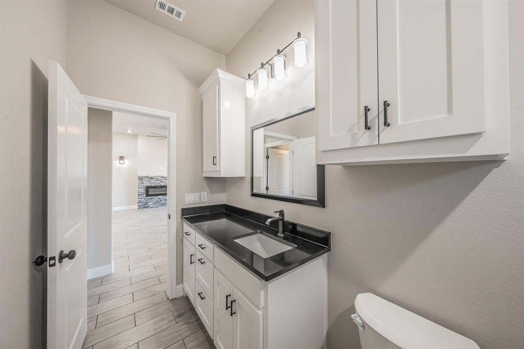 112 Stevens Street Bridgeport, TX 76426 - Photo 16 of 37 a bathroom with a sink and a mirror