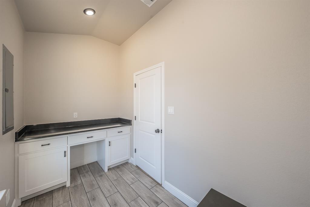 112 Stevens Street Bridgeport, TX 76426 - Photo 23 of 37 a view of cabinets with wooden floor