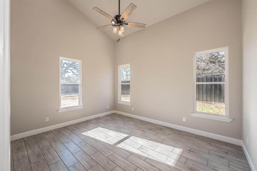 112 Stevens Street Bridgeport, TX 76426 - Photo 24 of 37 a view of empty room with wooden floor and fan