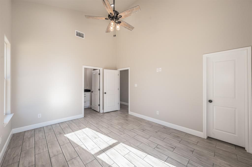 112 Stevens Street Bridgeport, TX 76426 - Photo 26 of 37 wooden floor in an empty room with a window