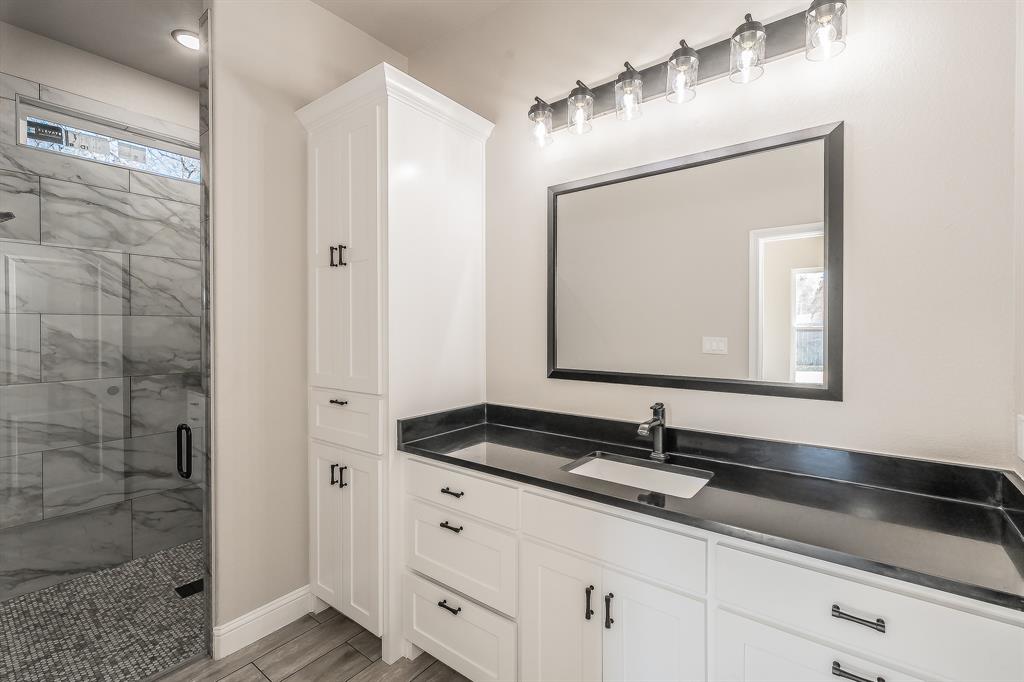 112 Stevens Street Bridgeport, TX 76426 - Photo 28 of 37 a bathroom with a sink and a mirror