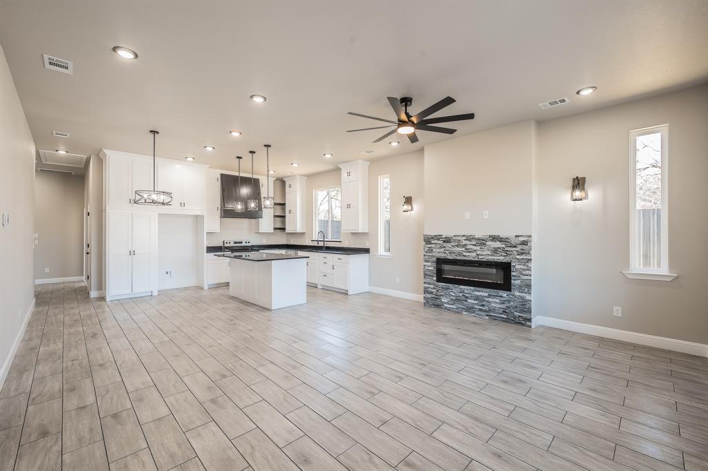 112 Stevens Street Bridgeport, TX 76426 - Photo 4 of 37 a view of kitchen with microwave and refrigerator