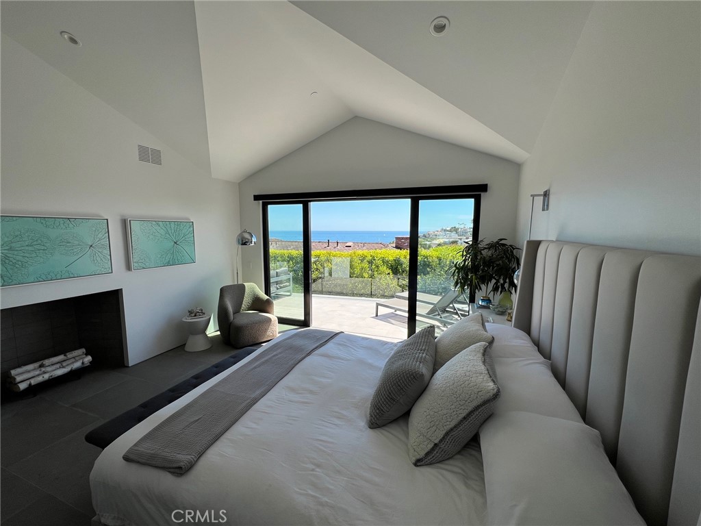 809 Emerald Bay Laguna Beach, CA 92651 - Photo 14 of 31 a living room with furniture and a flat screen tv