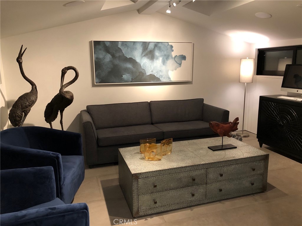 809 Emerald Bay Laguna Beach, CA 92651 - Photo 20 of 31 a living room with furniture and a flat screen tv