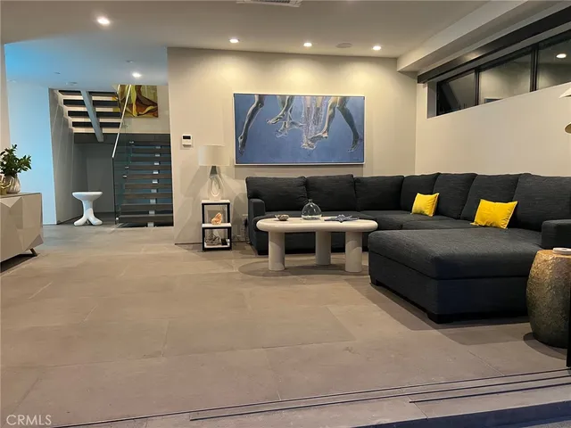 a living room with furniture and a rug