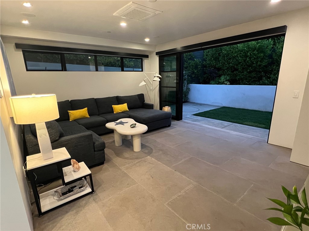 809 Emerald Bay Laguna Beach, CA 92651 - Photo 25 of 31 a living room with furniture and a rug