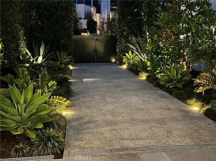 a view of a flower garden in a backyard