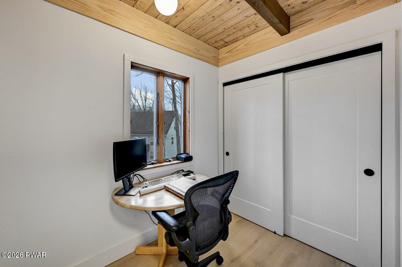 258 Lakeview Road Lackawaxen, PA 18435 - Photo 33 of 119 a view of workspace with wooden floor and chair