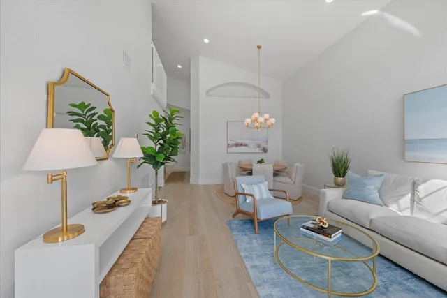 a living room with furniture and a lamp