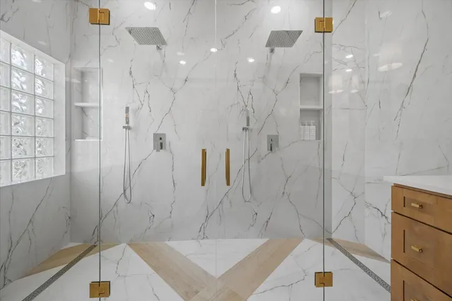 a view of a bathroom with sink and mirror