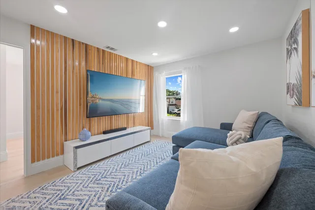 a living room with furniture and a rug