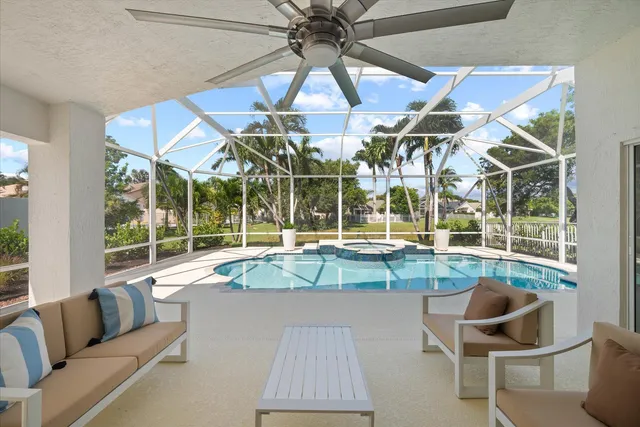 a view of a backyard with a swimming pool