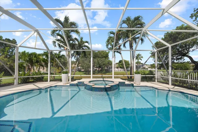 a view of a tennis room with windows