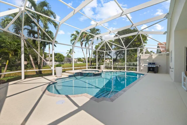 a view of a swimming pool with a patio