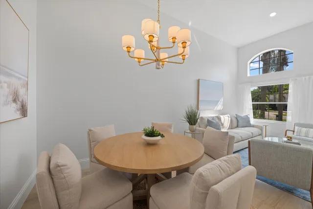 a view of a dining room with furniture and window