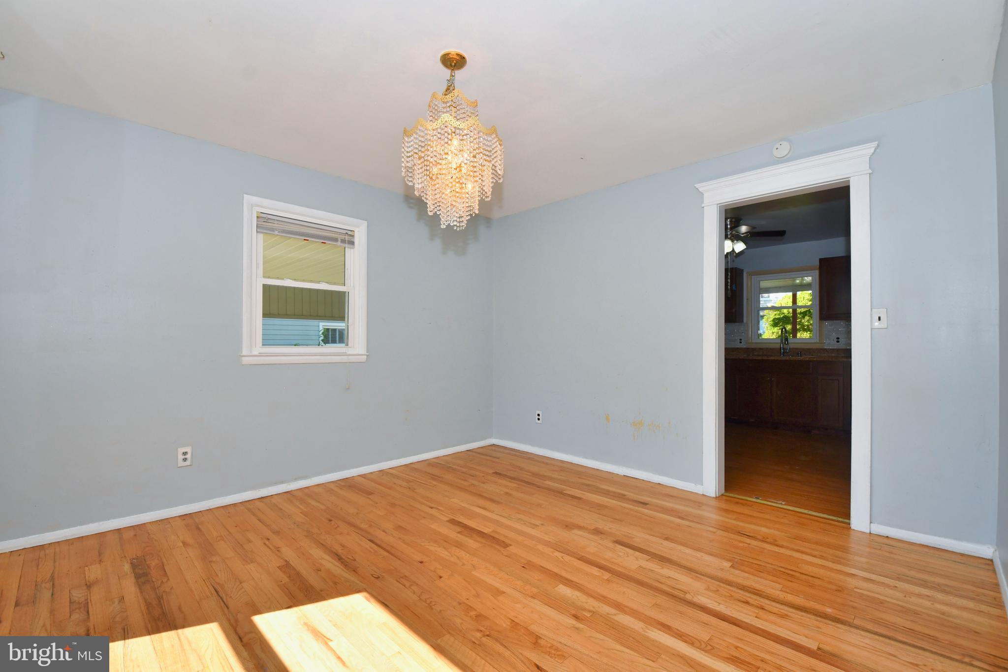 4704 Ebenezer Road Nottingham, MD 21236 - Photo 13 of 56 wooden floor in an empty room with a window