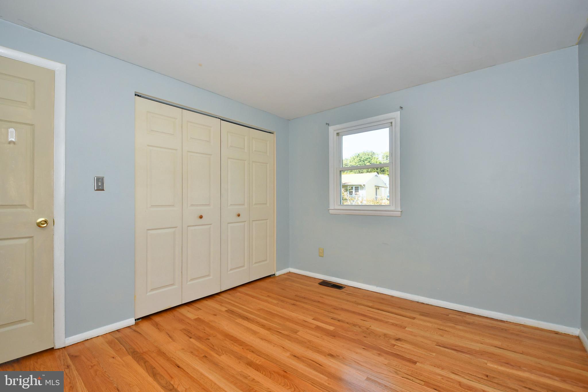 4704 Ebenezer Road Nottingham, MD 21236 - Photo 17 of 56 a view of empty room with wooden floor and fan