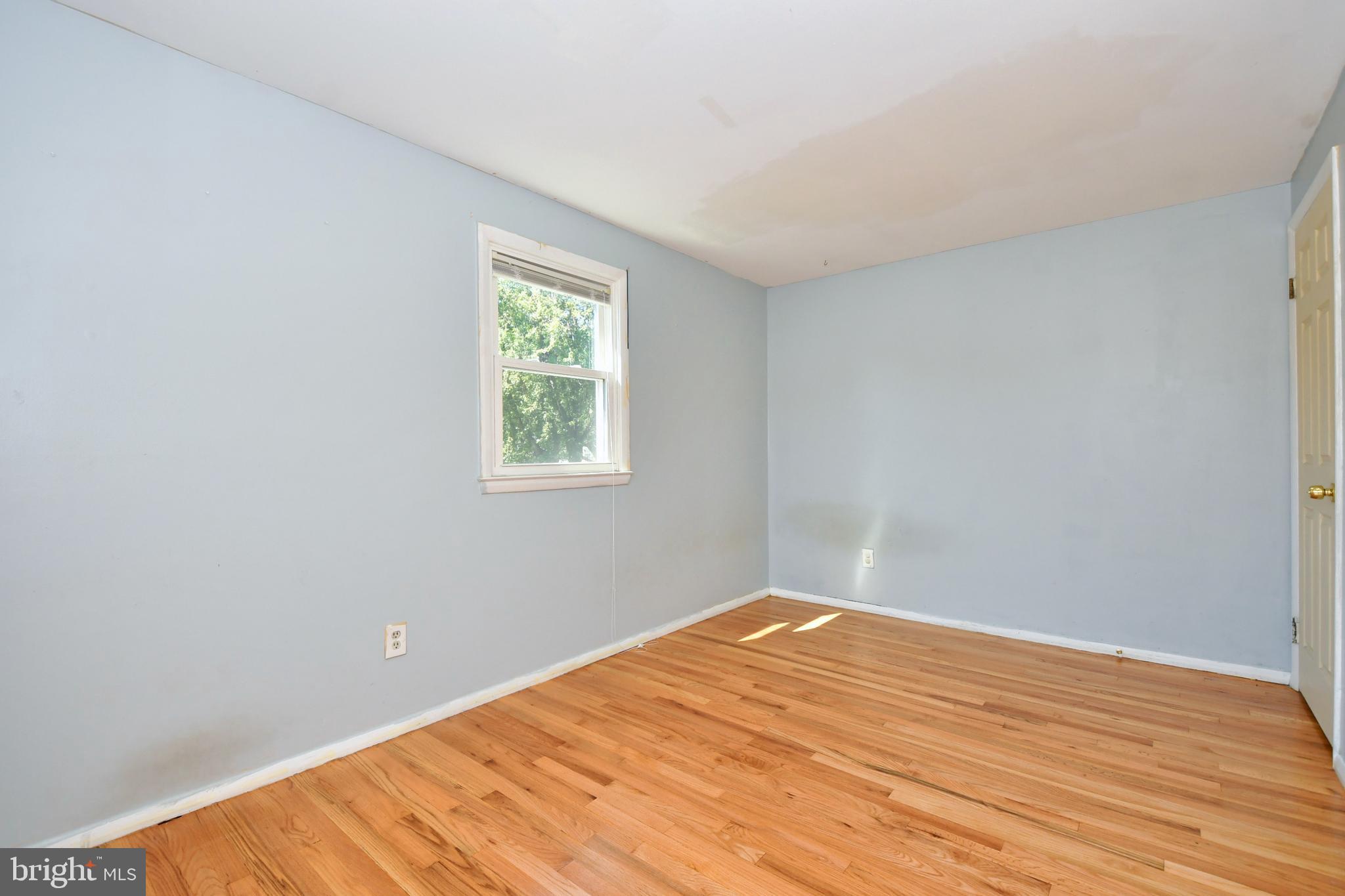 4704 Ebenezer Road Nottingham, MD 21236 - Photo 20 of 56 a view of empty room with wooden floor
