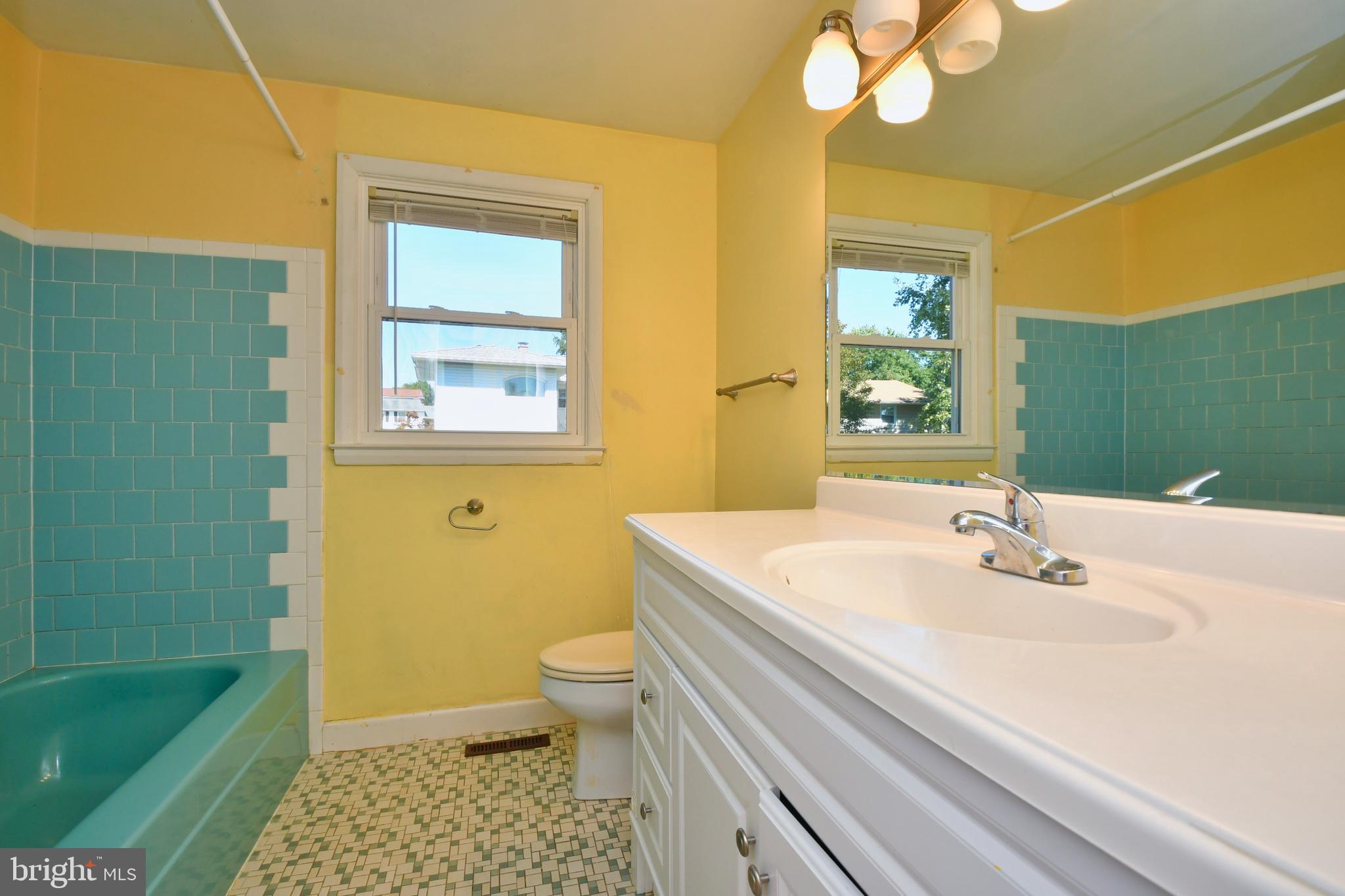 4704 Ebenezer Road Nottingham, MD 21236 - Photo 23 of 56 a bathroom with a sink a toilet and a bathtub
