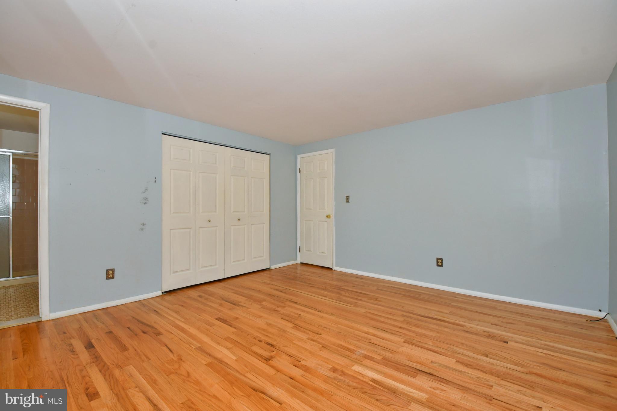 4704 Ebenezer Road Nottingham, MD 21236 - Photo 25 of 56 a view of empty room with wooden floor