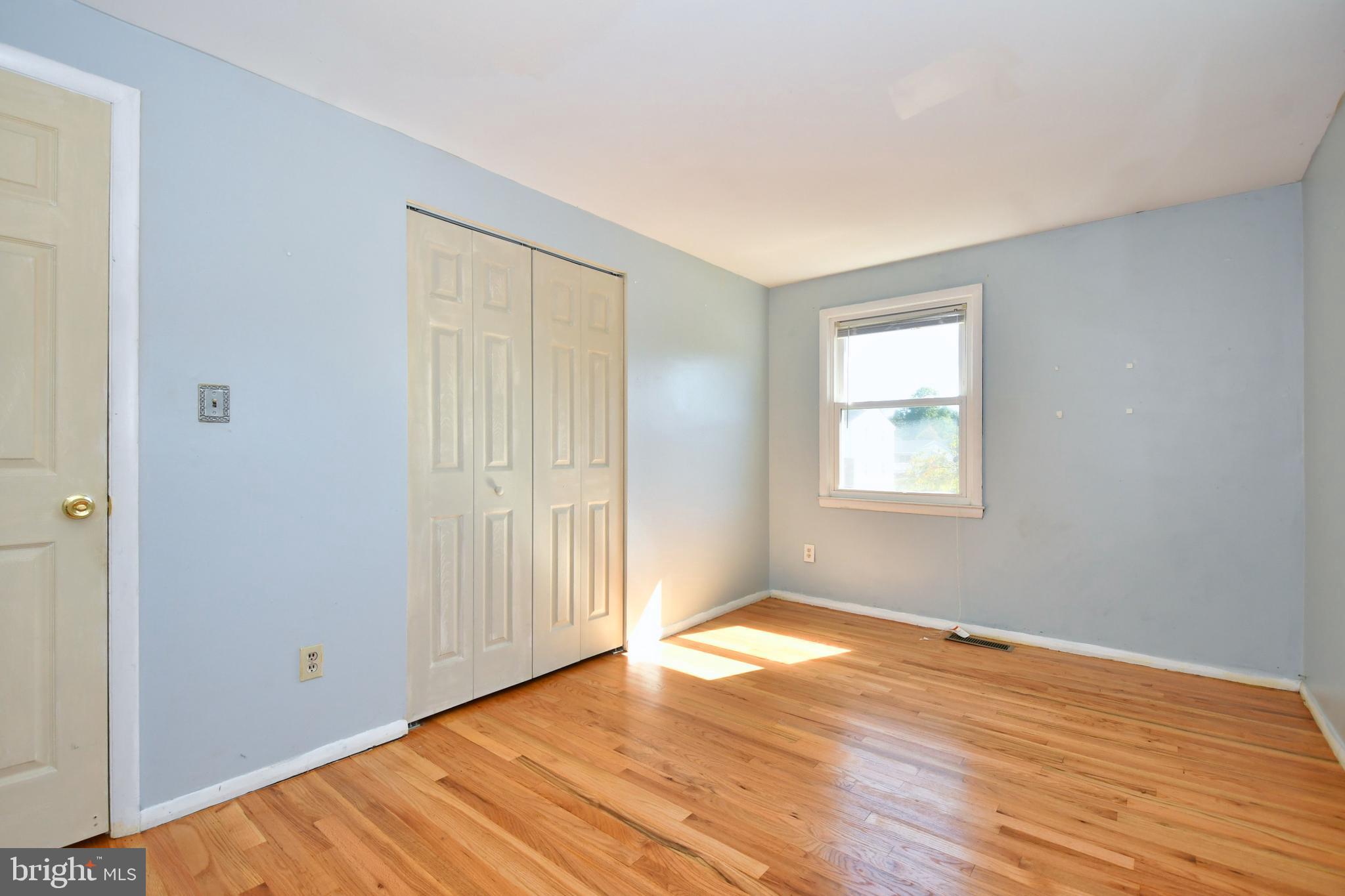4704 Ebenezer Road Nottingham, MD 21236 - Photo 26 of 56 an empty room with wooden floor and windows