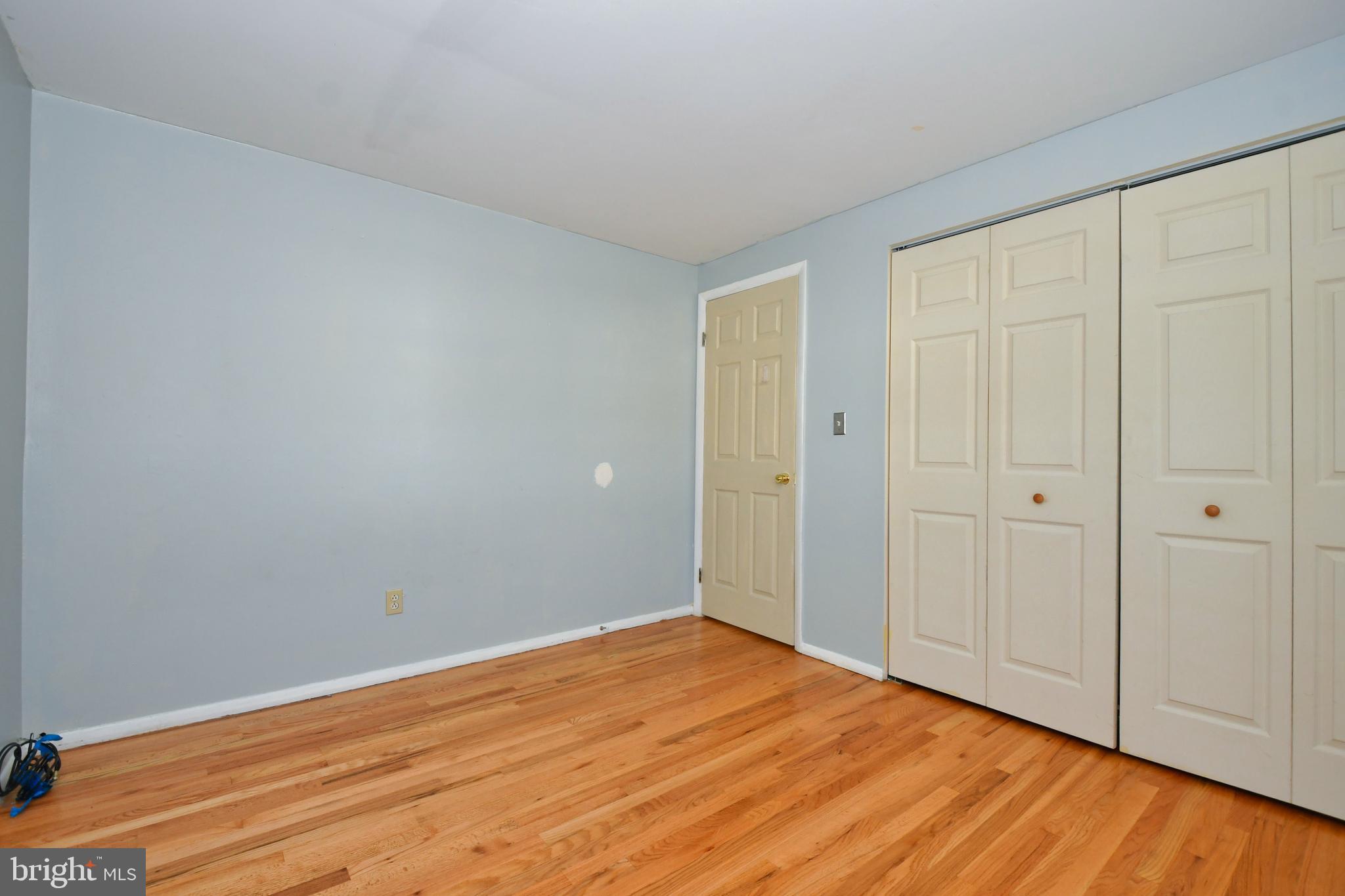 4704 Ebenezer Road Nottingham, MD 21236 - Photo 27 of 56 a view of empty room with wooden floor