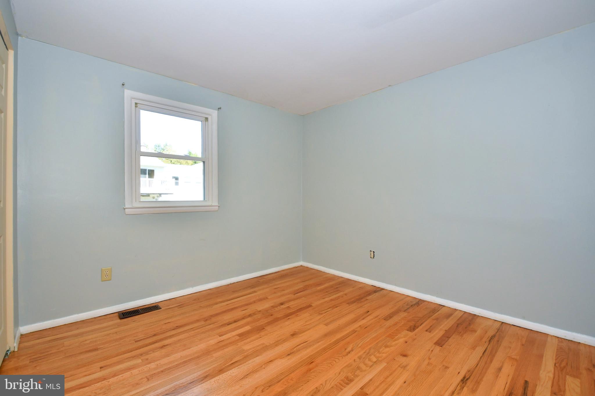 4704 Ebenezer Road Nottingham, MD 21236 - Photo 30 of 56 a view of empty room with wooden floor