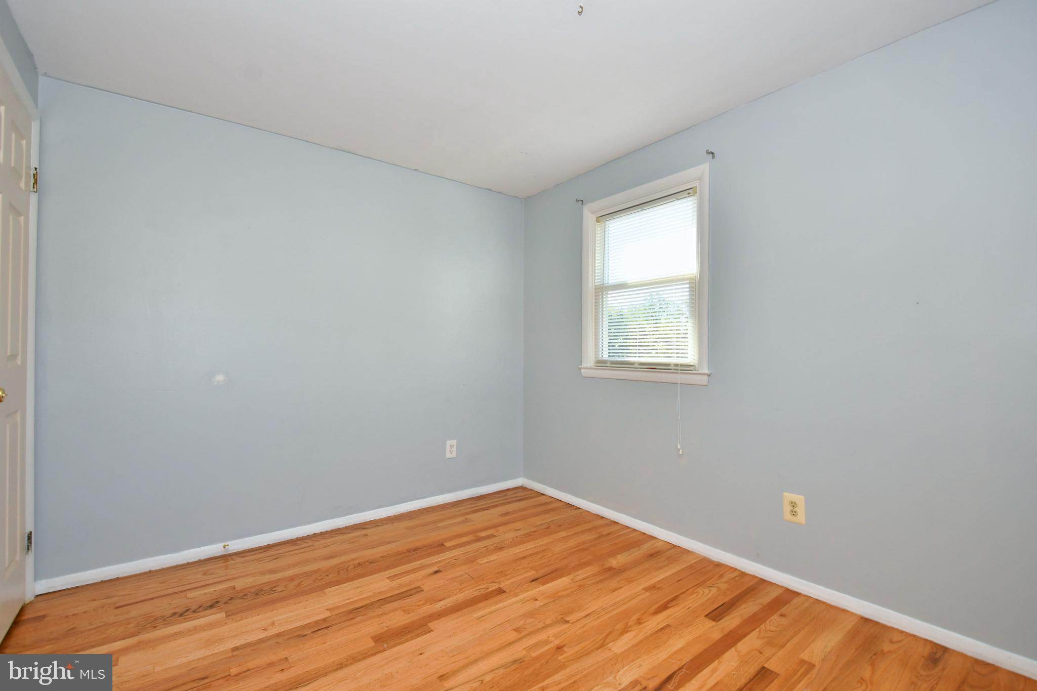 4704 Ebenezer Road Nottingham, MD 21236 - Photo 31 of 56 a view of empty room with wooden floor