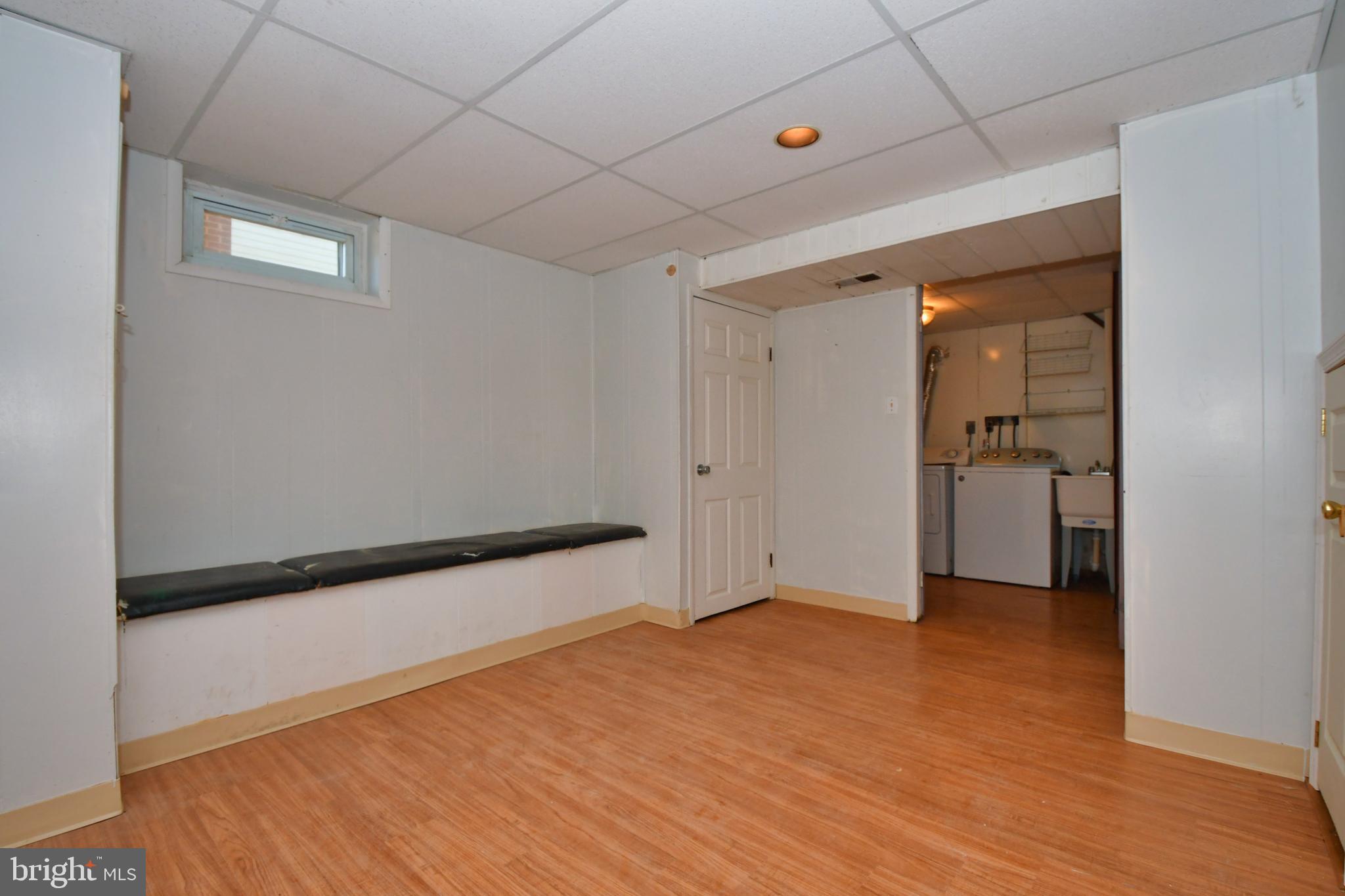 4704 Ebenezer Road Nottingham, MD 21236 - Photo 35 of 56 wooden floor in an empty room with a window