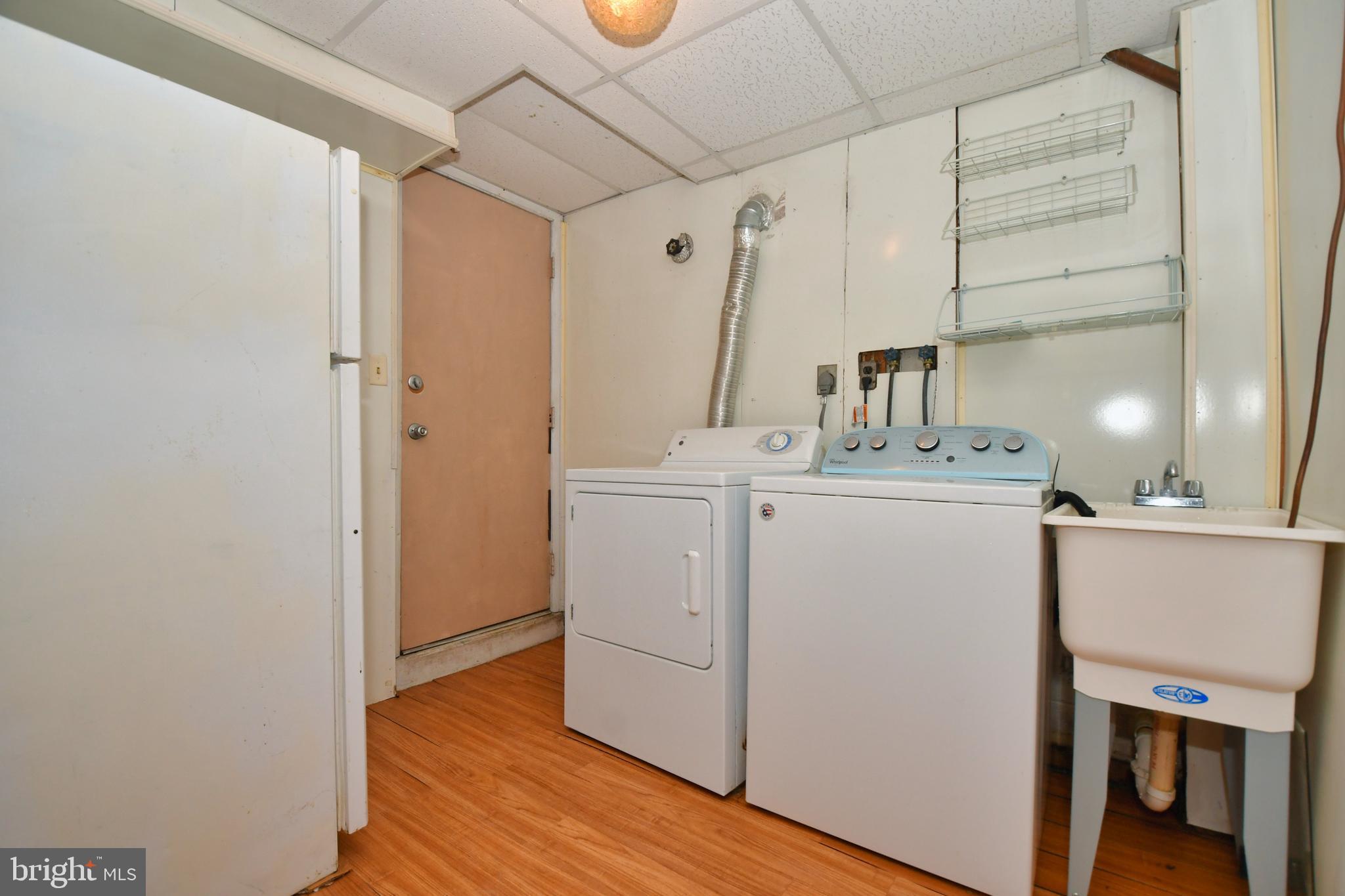 4704 Ebenezer Road Nottingham, MD 21236 - Photo 40 of 56 a utility room with closet dryer and washer