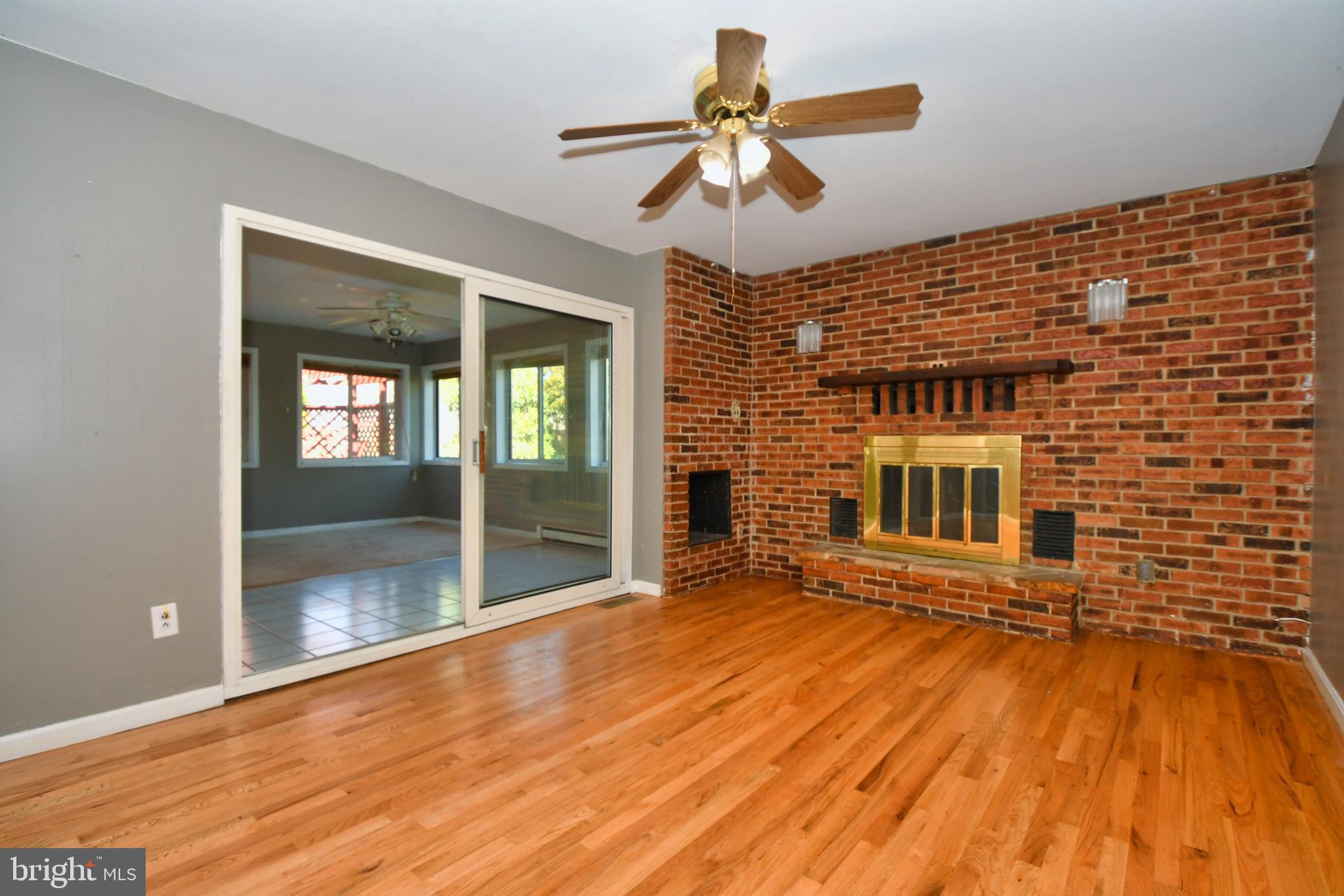 4704 Ebenezer Road Nottingham, MD 21236 - Photo 5 of 56 a view of livingroom with wooden floor and a ceiling fan