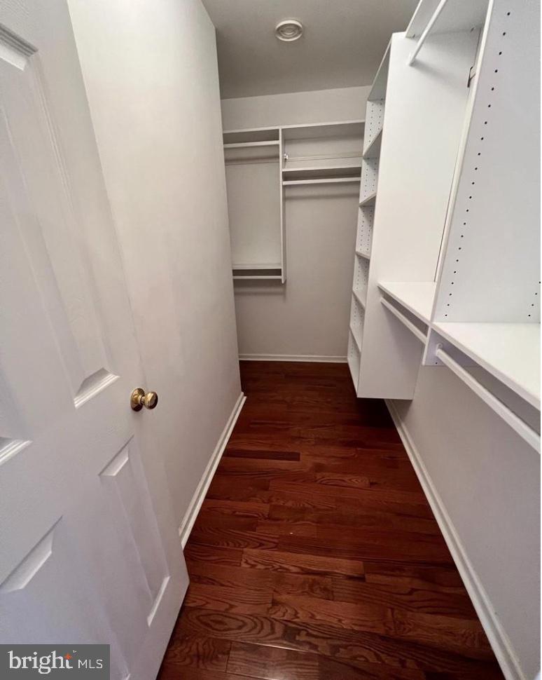 3303 Sterling Road Yardley, PA 19067 - Photo 11 of 16 a view of a hallway with wooden floor and staircase