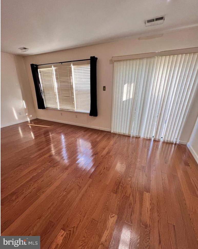 3303 Sterling Road Yardley, PA 19067 - Photo 3 of 16 wooden floor in an empty room with a window