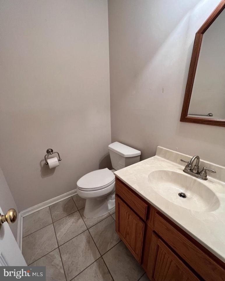 3303 Sterling Road Yardley, PA 19067 - Photo 8 of 16 a bathroom with a sink mirror and toilet